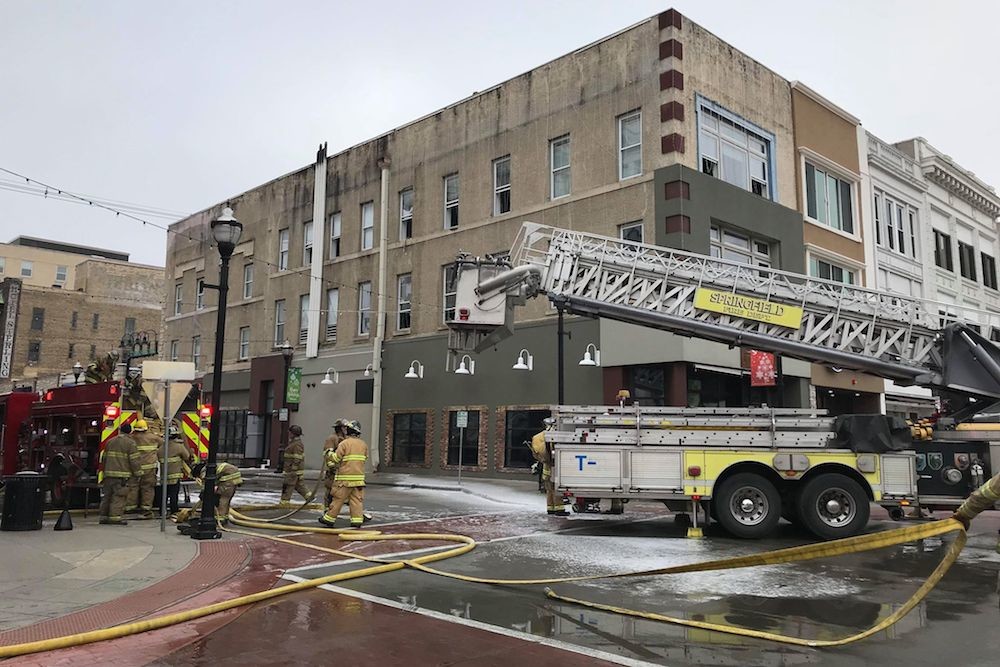 An electrical fire on the roof caused the building’s sprinkler system to go off, says Fire Chief David Pennington.